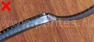 Электронные компоненты в катушке: лента с изломом